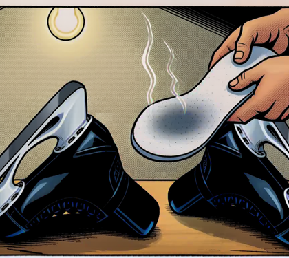 A hand pulling a damp insole out of a black hockey skate while a second skate lies on the bench, stink lines rising