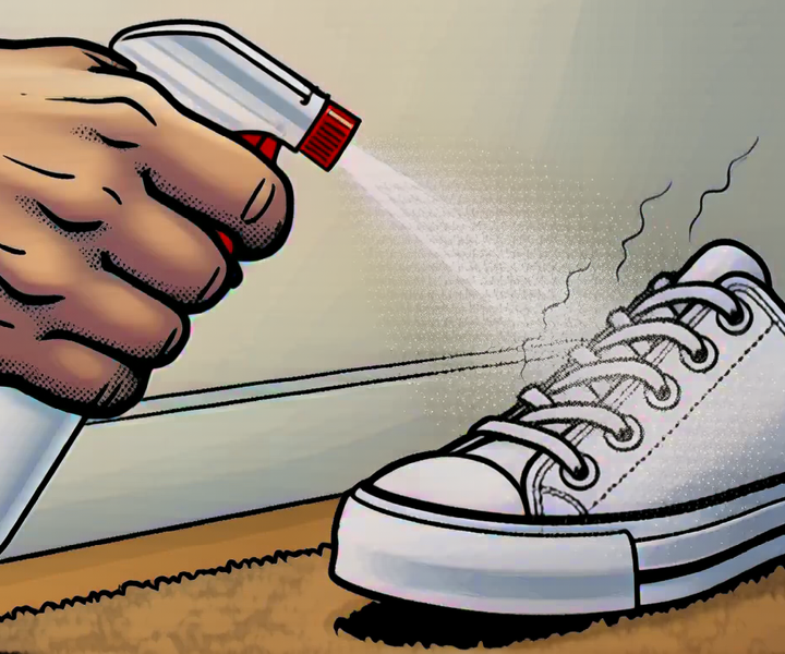 A hand spraying a sneaker on a doormat with a small spray bottle, stink lines parting away from the mist